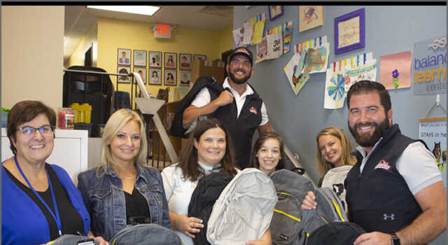 Balanced Learning Center team with Couto Construction owners